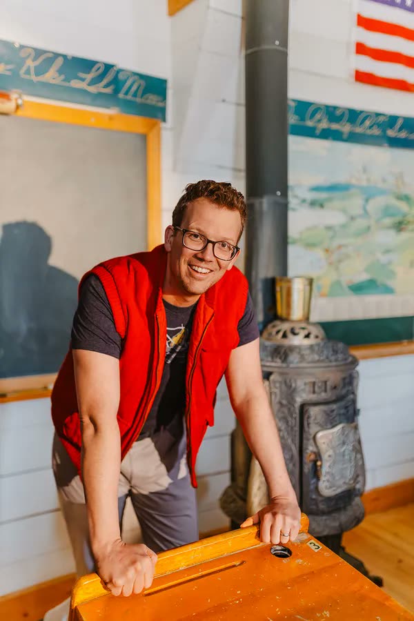 A content creator smiling at his desk